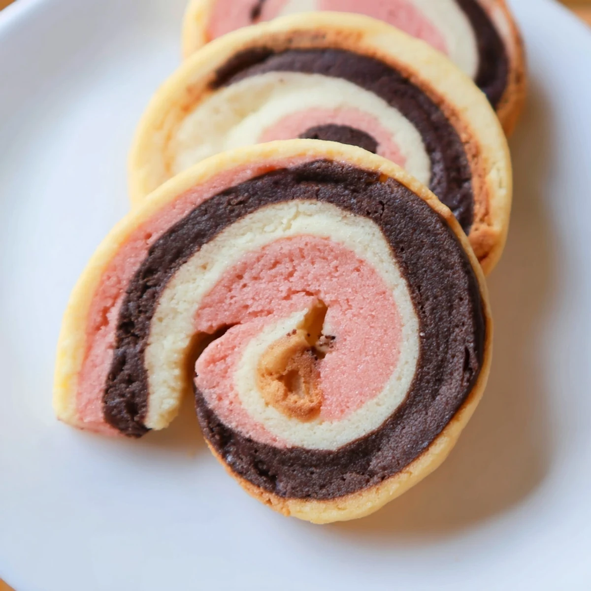 Soft Neapolitan Swirl Cookies with tri-colored pinwheel design fresh from the oven