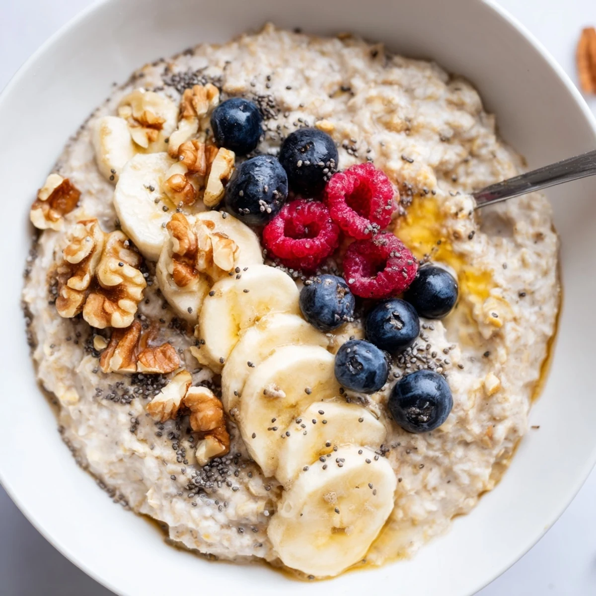 Post-workout Protein Oatmeal, creamy texture, sprinkled chopped almonds and fresh berries