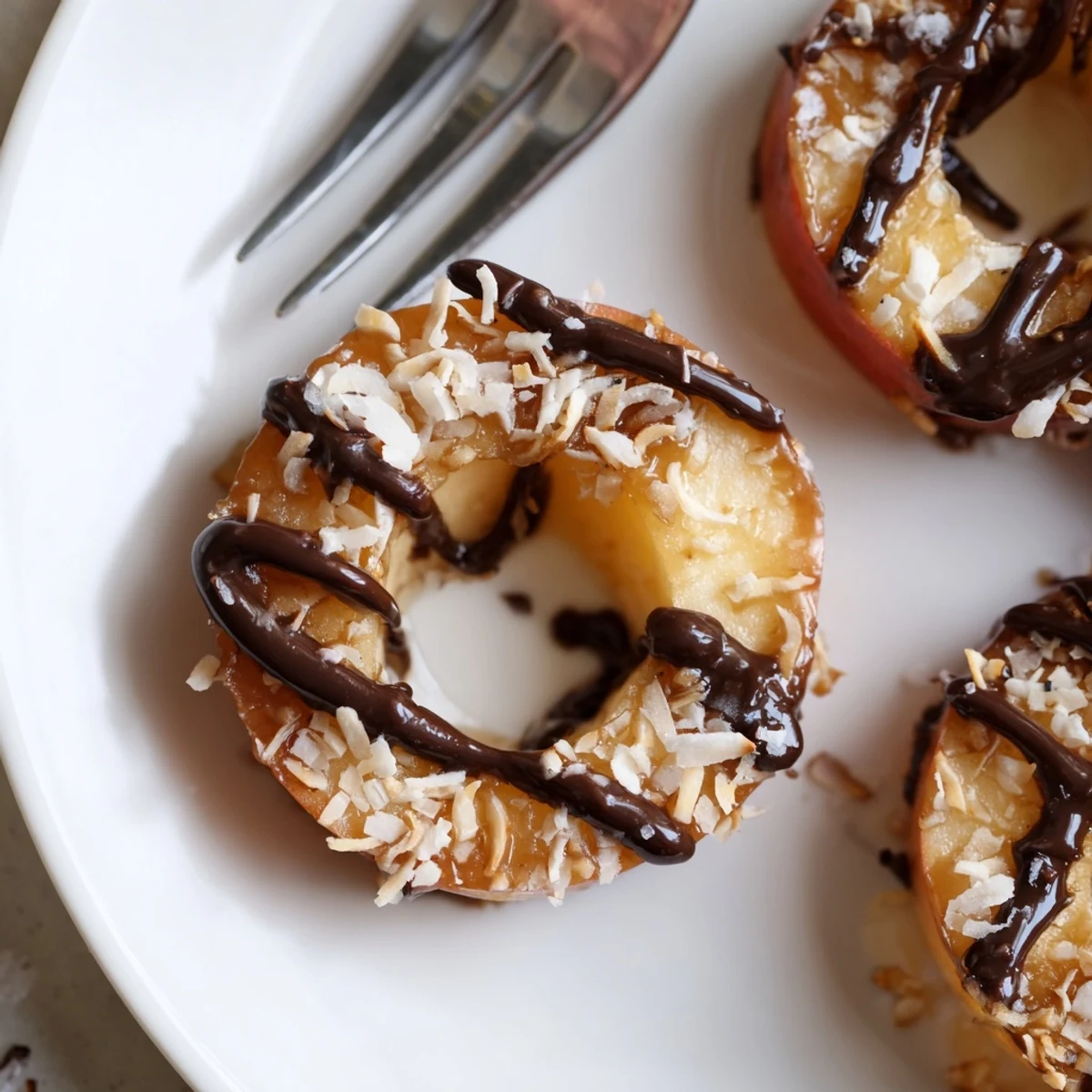 Samoa Apple Slices with gooey caramel, toasted coconut, and melted chocolate drizzle