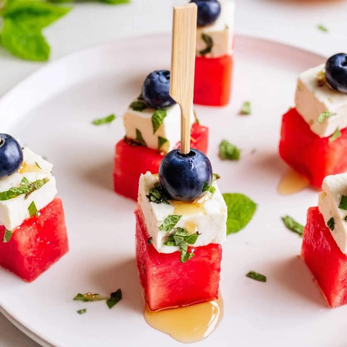 Bright Patriotic Watermelon Feta Skewers with blueberries, honey drizzle, refreshing bite
