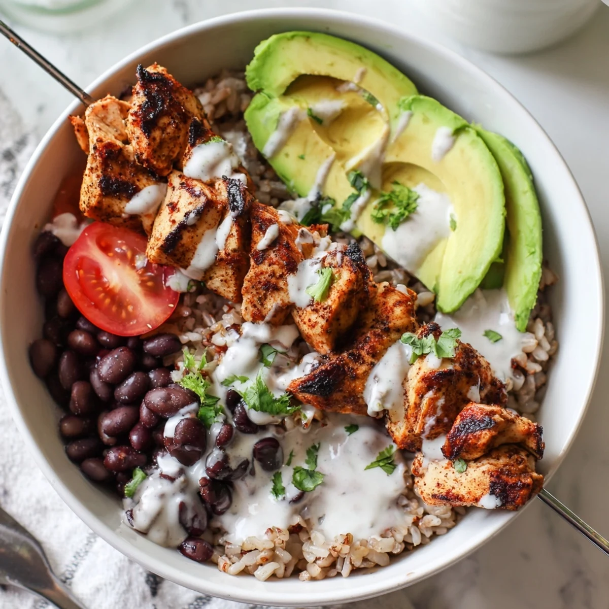 Smoky Chicken Skewer Bowl with charred grill marks, creamy avocado, lime wedges