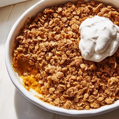 Creamy spiced pumpkin pie crisp topped with crumbly brown sugar oat streusel